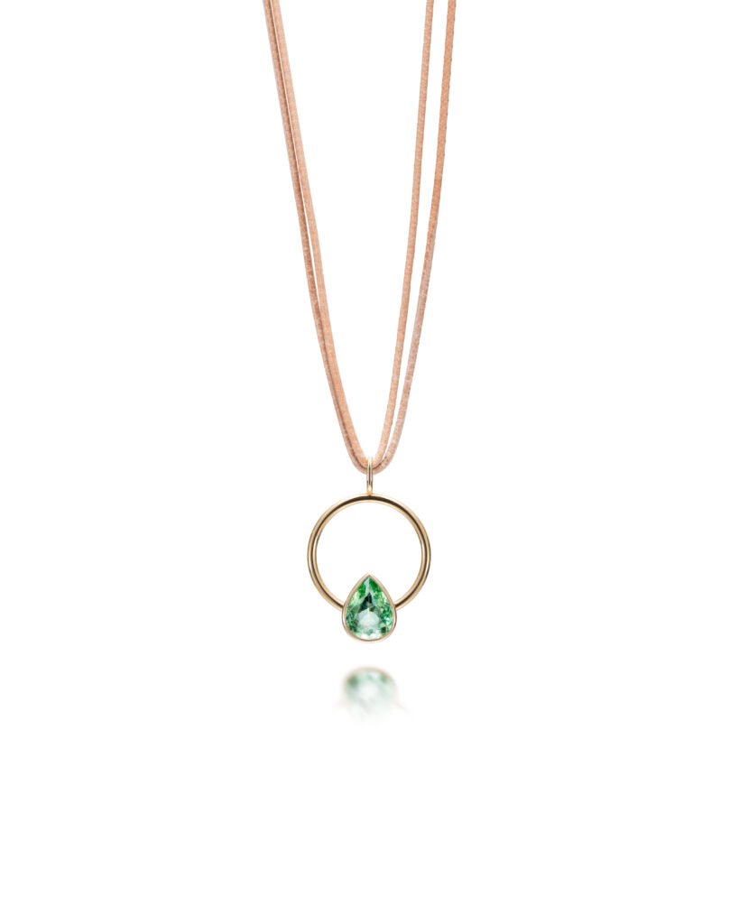gold circle pendant with drop-shaped tourmaline with letter cord