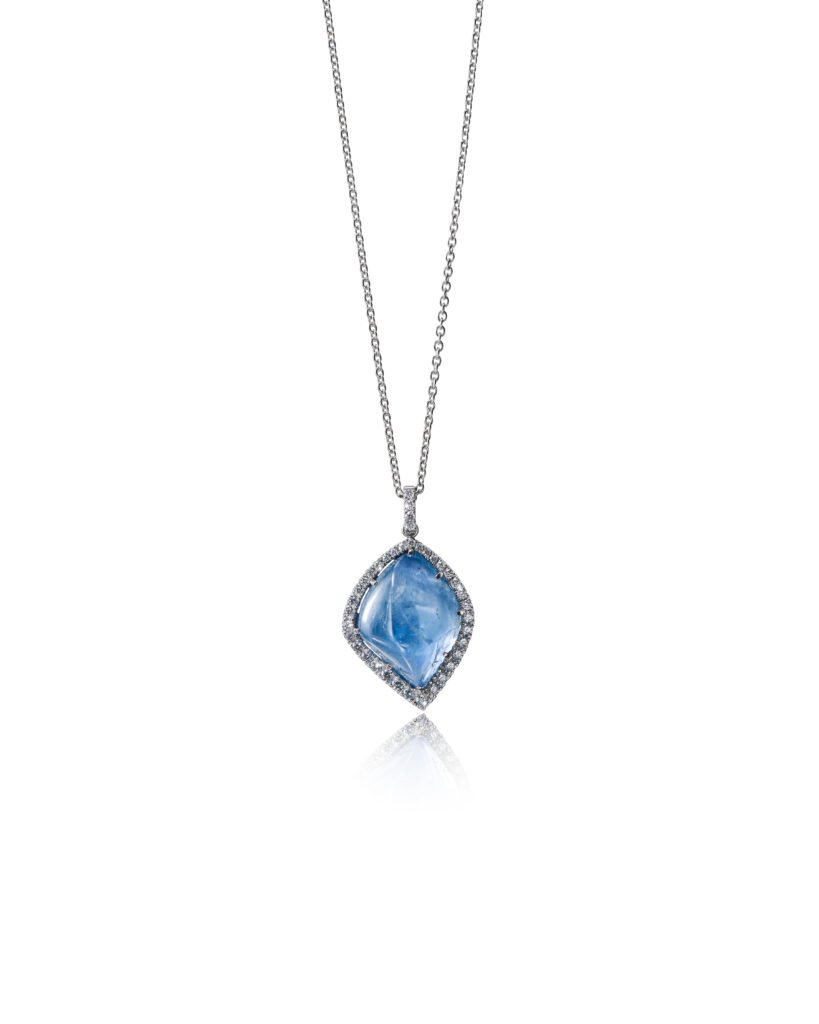blue sapphire pendant with diamond halo in white gold