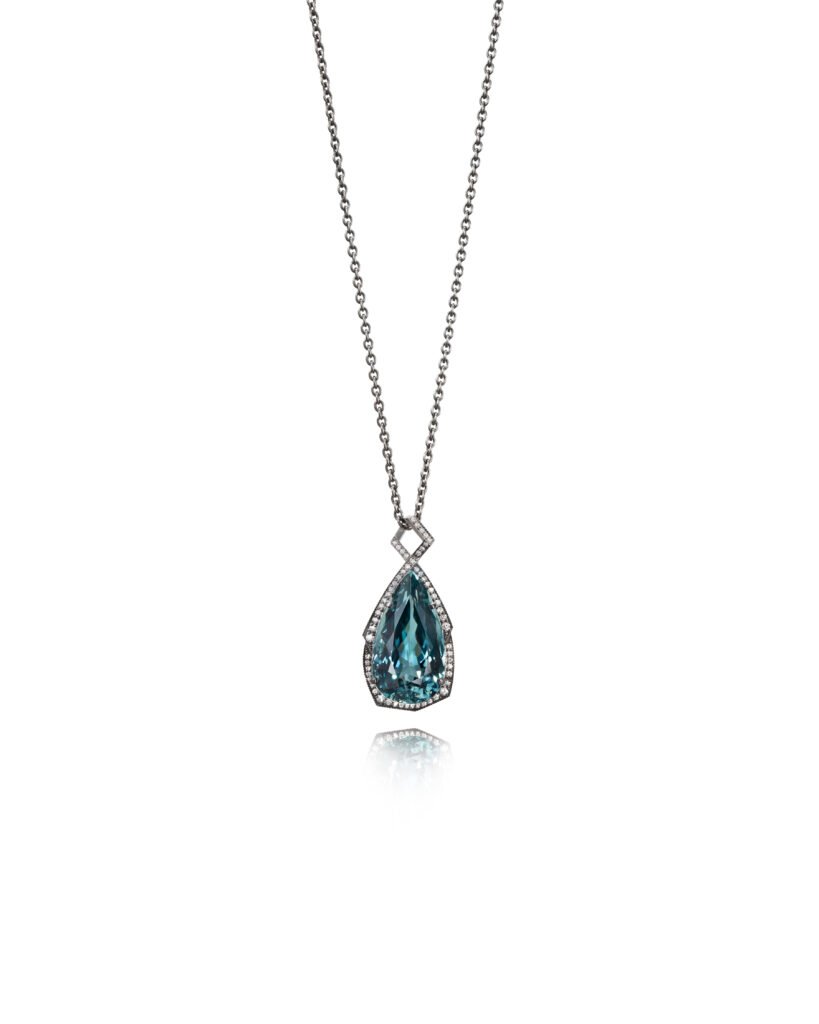 blue tourmaline pendant with diamond halo in white gold