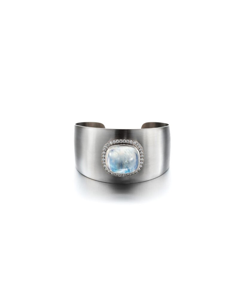 wide white gold bangle bracelet with moonstone and diamond halo