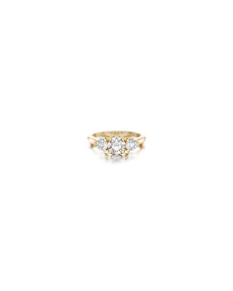 three stone ring with diamonds in gold