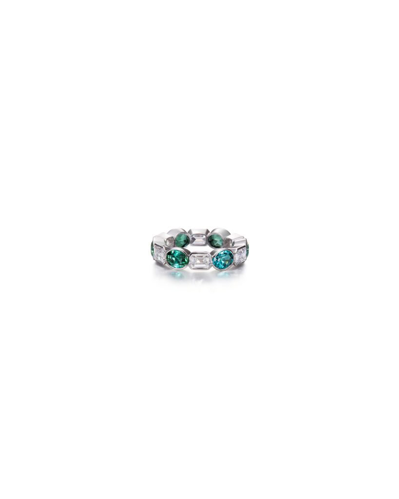 white gold diamond eternity ring with green tourmalines