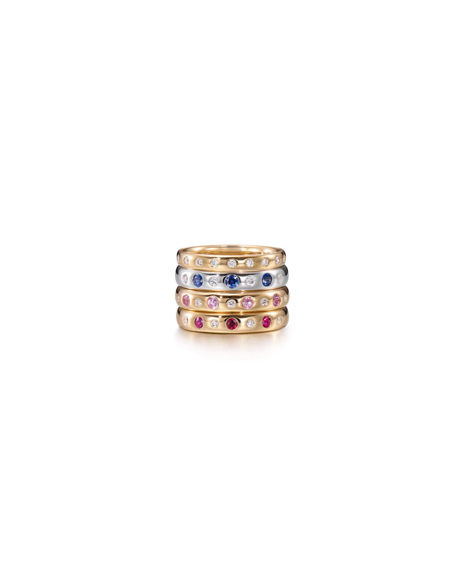 white gold and yellow gold rings with diamonds and gemstones