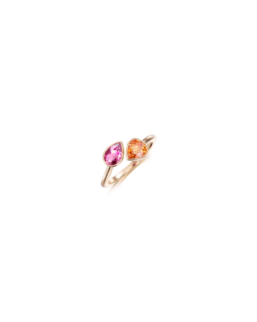 A toi et moi ring with a spessartite garnet and a tourmaline